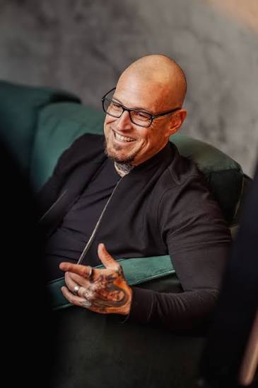 JJ Mazzo seated and smiling